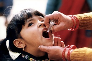 A young girl receiving an oral vaccine for polio. Source: CDC Global